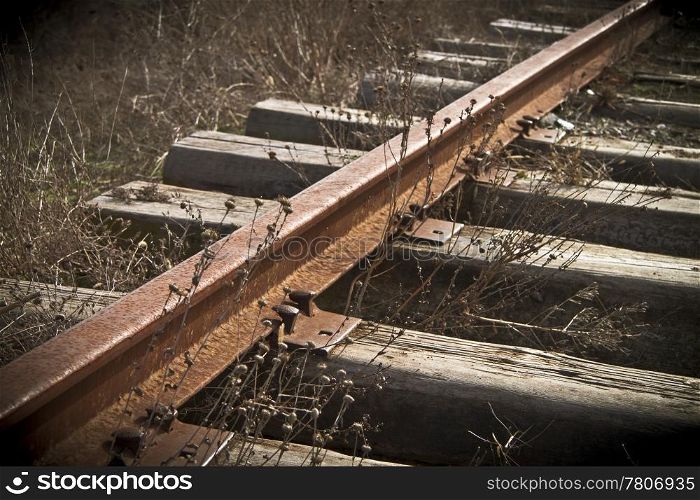 Rusty rails on the thrown railway way