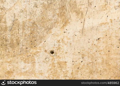 Rusty stone concrete surface in tan color, detailed natural texture.