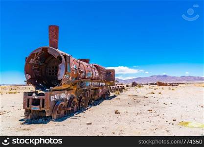 Rusty train in the famous train cemetry at Salar de Uyuni in Bolivia