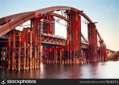 Rusty unfinished bridge over the river in Kiev, Ukraine