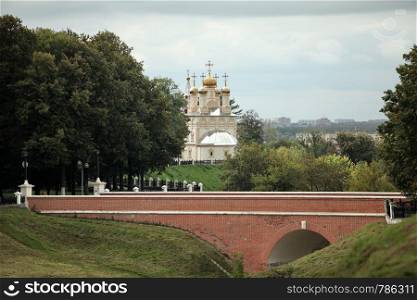 Ryazan Russia September 10, 2013 christian church on high river bank,stone bridge red brick. christian church on high river bank