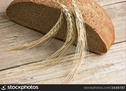 rye bread, and corn on the wooden table