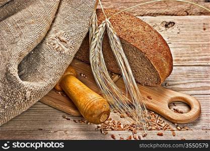 rye bread, and corn on the wooden table