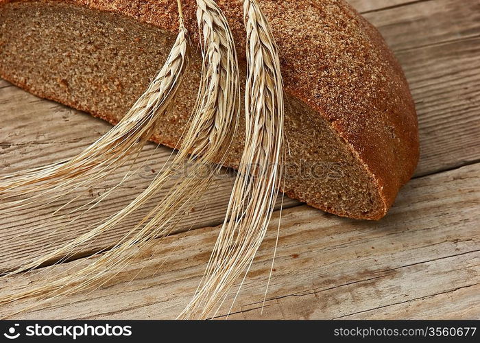 rye bread, and corn on the wooden table