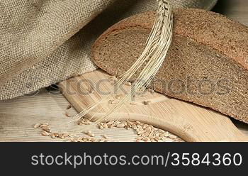 rye bread, and corn on the wooden table