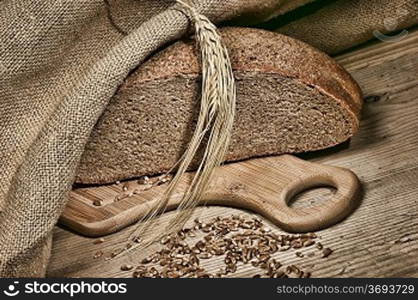 rye bread, and corn on the wooden table