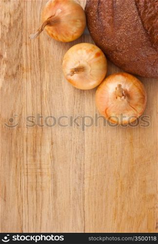 rye bread and onions on a cutting board isolated on white