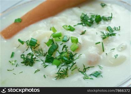 Sachsische Kartoffelsuppe - potato soup with sausages. German and Austrian cuisine