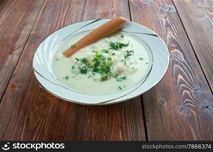 Sachsische Kartoffelsuppe - potato soup with sausages. German and Austrian cuisine