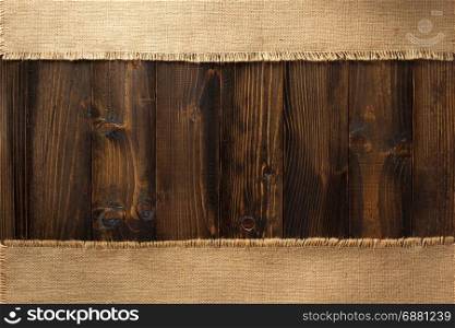 sack burlap hessian at wooden plank background