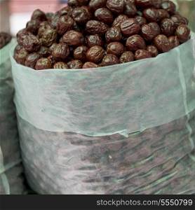 Sack of dried fruits in market, Dong Dajie, Dunhuang, Jiuquan, Gansu Province, China