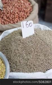Sack of Jeera for sale at the market with price label