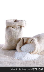 Sack of rice isolated on a burlap.