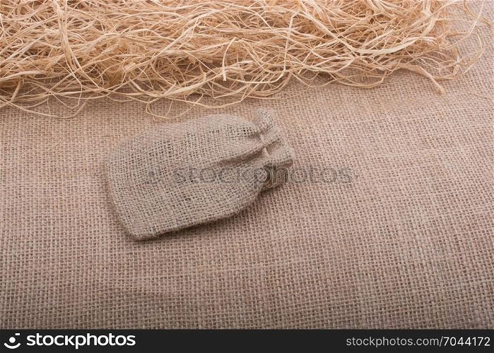 Sack placed on straw on canvas background
