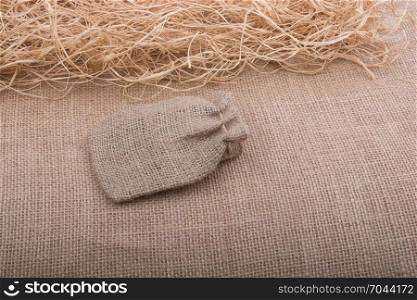 Sack placed on straw on canvas background