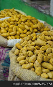 Sacks of turmeric root for sale at the market