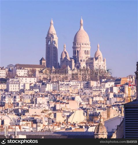Sacre-Coeur Basilica in the morning, Paris, France. Aerial view of Sacre-Coeur Basilica or Basilica of the Sacred Heart of Jesus at the butte Montmartre in the morning, Paris, France