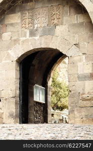 Sacred place at Ancient monastery Geghard in the mountains of Armenia. Was founded in 4th century.