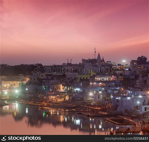 Sacred Puskhar lake (Sagar) and ghats of town Pushkar in twilight in the evening, Rajasthan, India