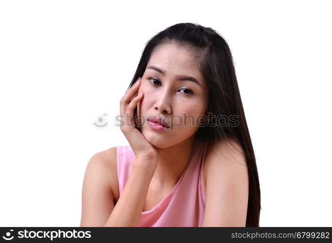 Sad beautiful woman standing against a white background