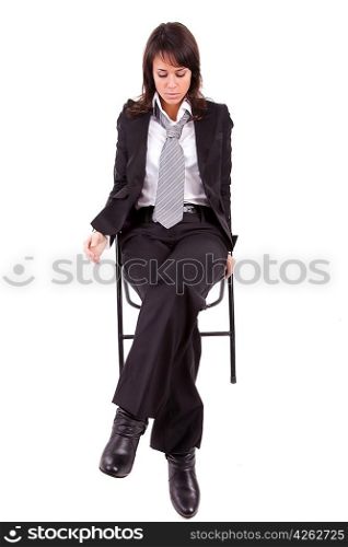 Sad business woman sitting on a chair