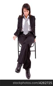 Sad business woman sitting on a chair