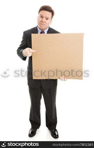 Sad businessman holding cardboard sign, ready for your text. Full body isolated on white.