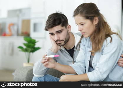 sad couple after negative pregnancy test result