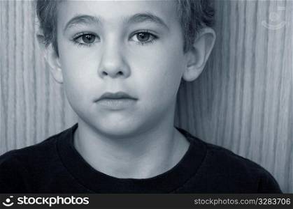 Sad face of a young boy.