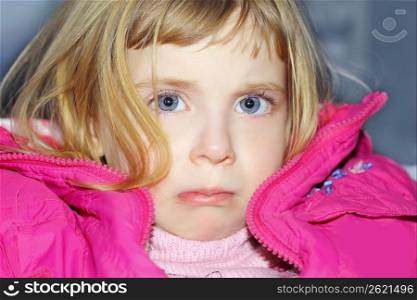 sad gesture blond little girl portrait pink coat