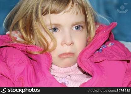 sad gesture blond little girl portrait pink coat