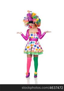Sad girl clown with a big colorful wig isolated on white background
