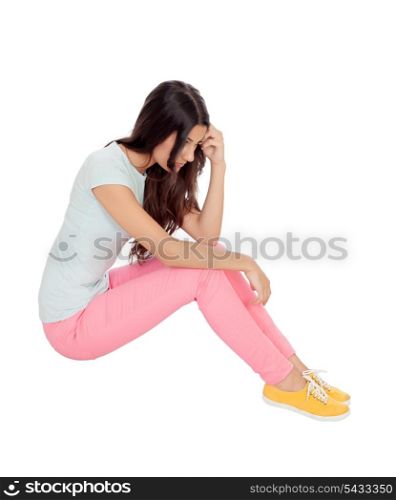 Sad girl sitting on the floor isolated on white background