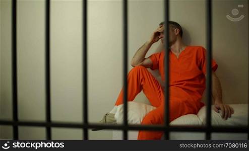 Sad inmate struggles in prison