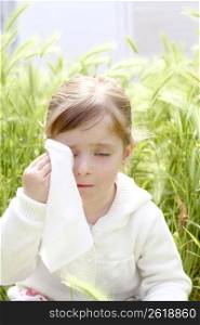 sad little girl crying outdoor green meadow field cereal spike grass