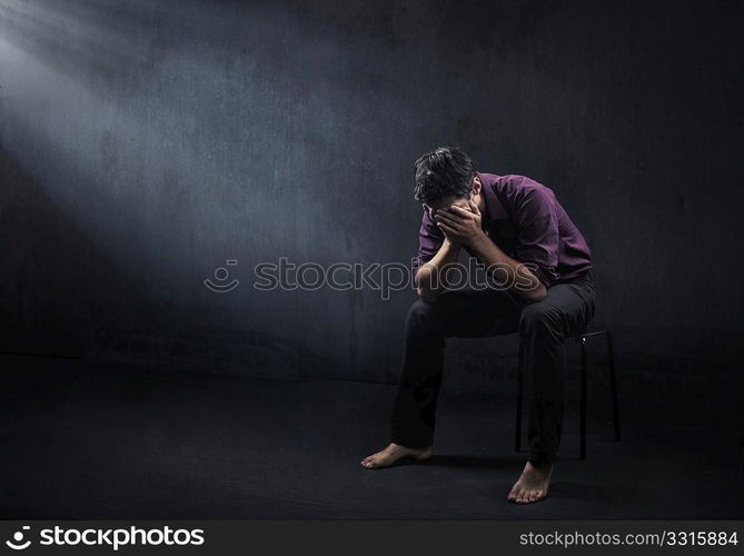 Sad man in a empty room