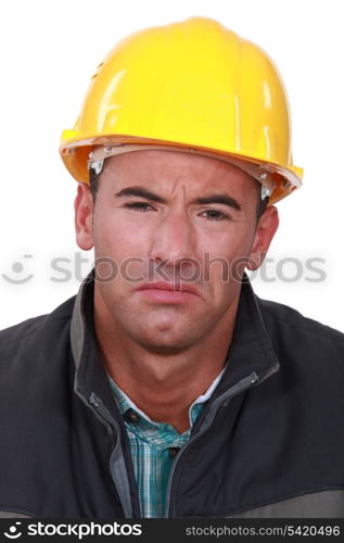 Sad man in a hard hat