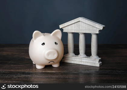 Sad piggy bank and state building. crisis, depletion of savings and bankruptcy. Financial default. Devaluation, inflation. Impoverishment. Refinancing and restructuring of debts. Insolvency