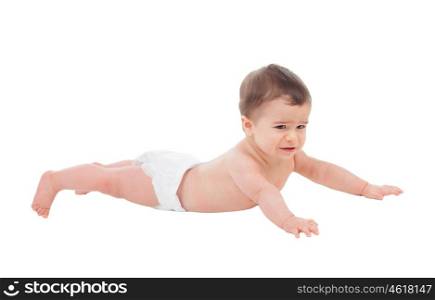 Sad six month baby in diaper lying on the floor isolated on white background