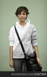 sad teen with black bag, soft natural light ,selective focus on face