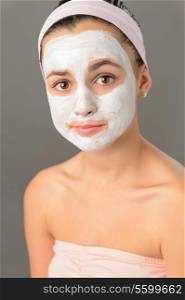 Sad teenage girl face mask skin beauty on gray background