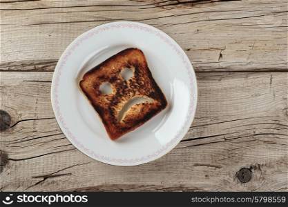 Sad toast on an old wooden board