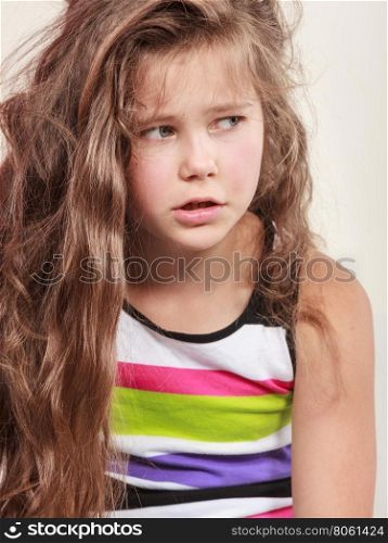 Sad unhappy little girl kid portrait.. Portrait of sad unhappy little girl kid. Lonely depressed child. Bad mood.
