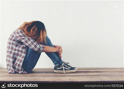 sad woman hug her knee and cry so lonely.