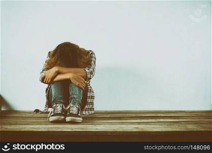 Sad woman hug her knee,nobody