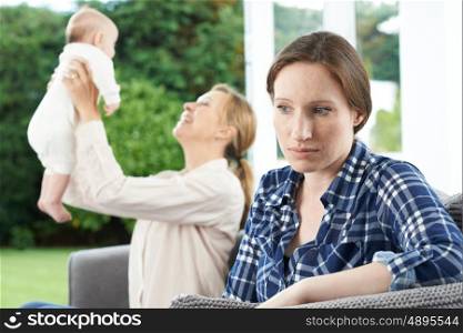 Sad Woman Jealous Of Friend With Young Baby
