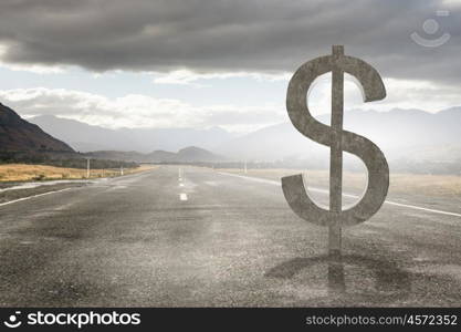 Safe deposit symbol. Big stone dollar currency sign on asphalt road