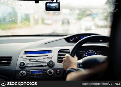 Safe drive on rainy day, speed control and security distance on the road, driving safely