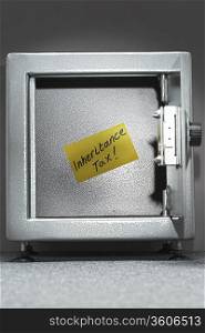 Safe with sticky note reading &acute;inheritance tax&acute;