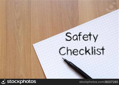 Safety checklist text concept write on notebook with pen